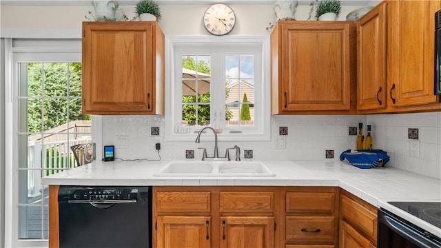 24 Mello St, West Warwick, RI 02893 - kitchen with dishwasher, backsplash, light countertops, and healthy amount of natural light