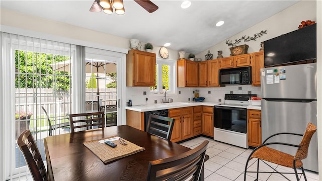 24 Mello St, West Warwick, RI 02893 - kitchen featuring black appliances, backsplash, a ceiling fan, light countertops, and light tile patterned floors
