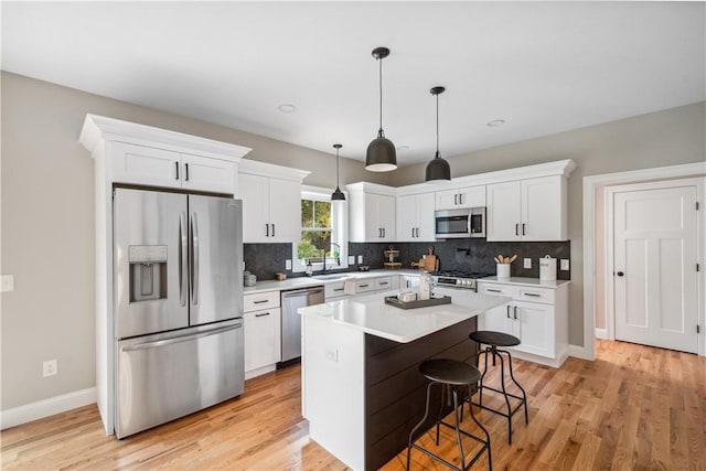 156 Potter St, Cranston, RI 02910 - kitchen with stainless steel appliances, white cabinets, tasteful backsplash, and recessed lighting