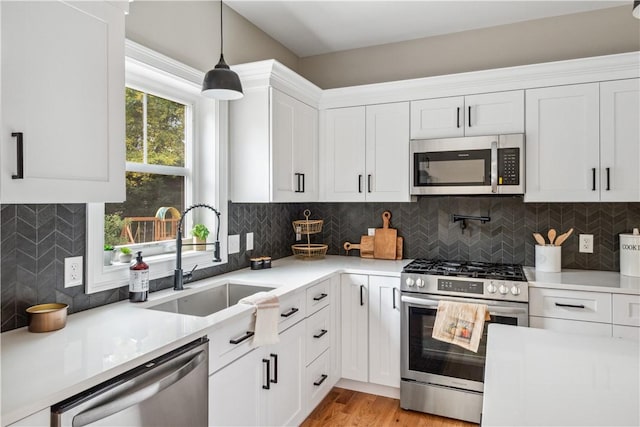 156 Potter St, Cranston, RI 02910 - kitchen with stainless steel appliances, light countertops, and white cabinets