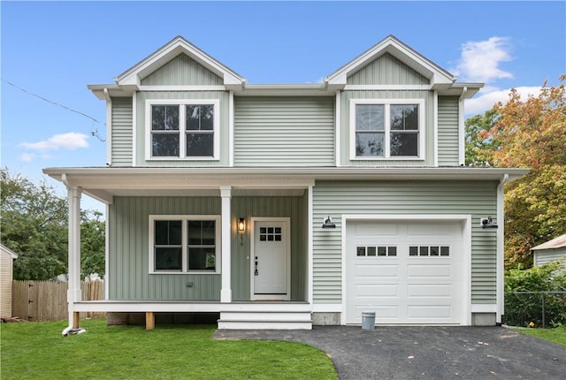 156 Potter St, Cranston, RI 02910 - view of front facade with a porch, an attached garage, board and batten siding, and asphalt driveway