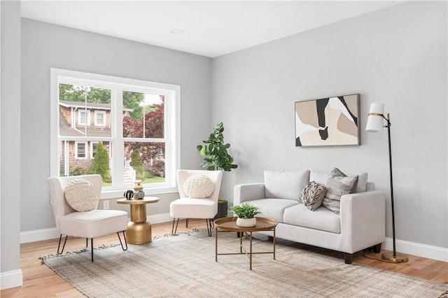119 Myrtle Ave, Cranston, RI 02910 - living area featuring plenty of natural light and wood finished floors