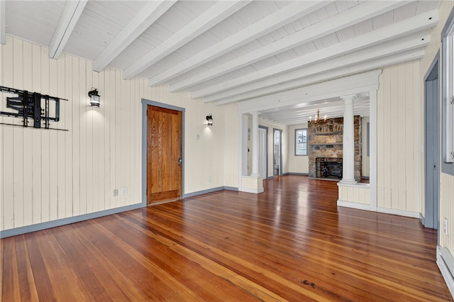 1 Barney Ave, South Kingstown, RI 02879 - unfurnished living room with ornate columns, hardwood / wood-style flooring, a fireplace, beamed ceiling, and a baseboard radiator