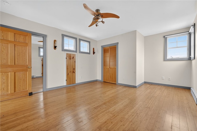 1 Barney Ave, South Kingstown, RI 02879 - empty room with a ceiling fan, light wood-type flooring, and healthy amount of natural light