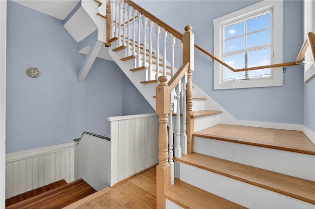 1 Barney Ave, South Kingstown, RI 02879 - stairs featuring wood finished floors and a wainscoted wall