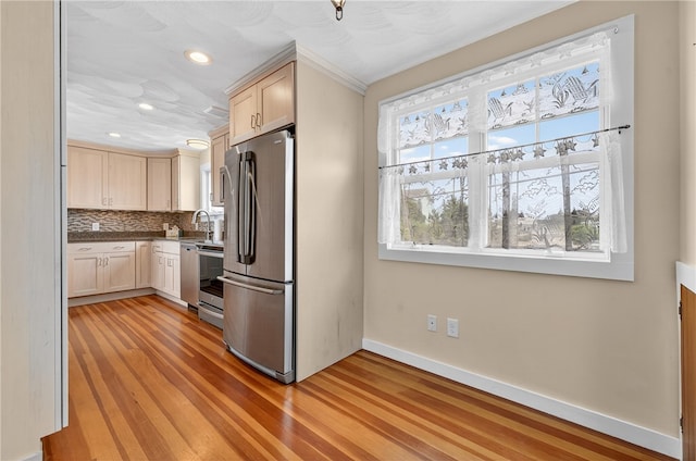 1 Barney Ave, South Kingstown, RI 02879 - kitchen featuring stainless steel appliances, light brown cabinets, light wood-style floors, tasteful backsplash, and recessed lighting
