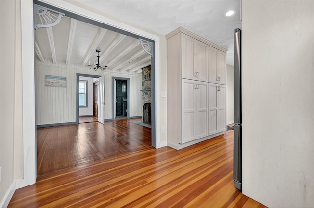 1 Barney Ave, South Kingstown, RI 02879 - unfurnished room featuring light wood-style floors, a chandelier, beam ceiling, and recessed lighting