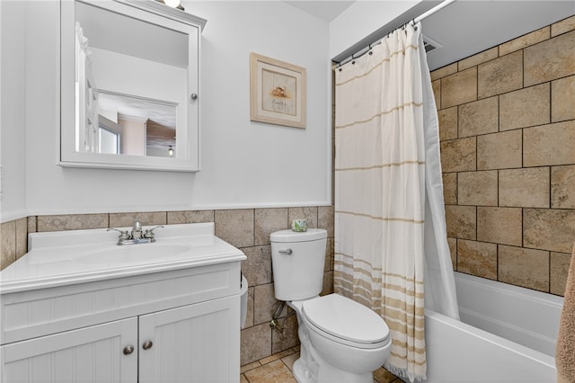 1 Barney Ave, South Kingstown, RI 02879 - bathroom featuring vanity, shower / bath combo with shower curtain, tile walls, and wainscoting