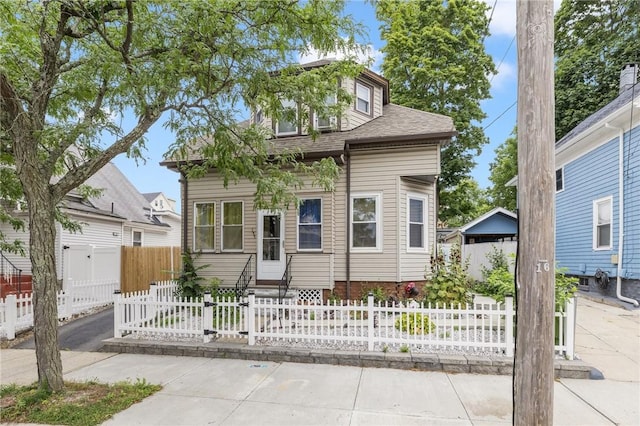 155 Early St, Providence, RI 02907 - view of front facade with a shingled roof, entry steps, and a fenced front yard