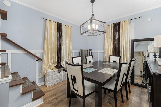 155 Early St, Providence, RI 02907 - dining area featuring a chandelier, wood finished floors, and ornamental molding