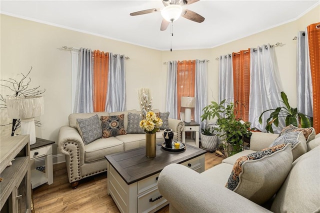 155 Early St, Providence, RI 02907 - living room featuring a ceiling fan, light wood-type flooring, and crown molding