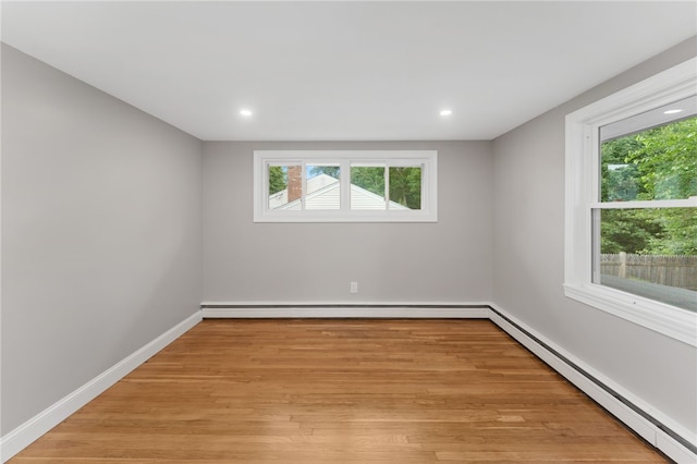 19 Cushing Rd, Warwick, RI 02888 - spare room featuring a baseboard heating unit, baseboard heating, light wood finished floors, and recessed lighting