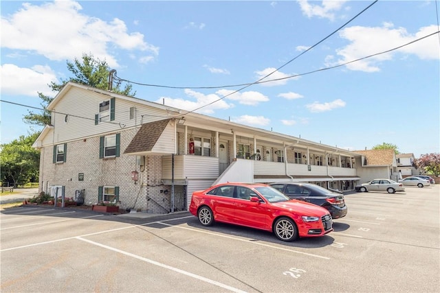20 Hurdis St Unit 6, North Providence, RI 02904 - view of front of property with uncovered parking and brick siding