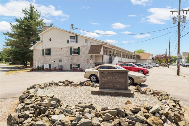 20 Hurdis St Unit 6, North Providence, RI 02904 - view of side of property featuring uncovered parking and brick siding