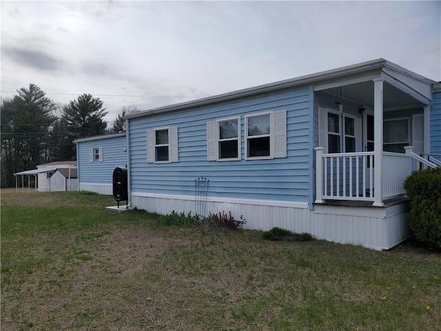 26 Lane E, Coventry, RI 02816 - view of side of home featuring a lawn