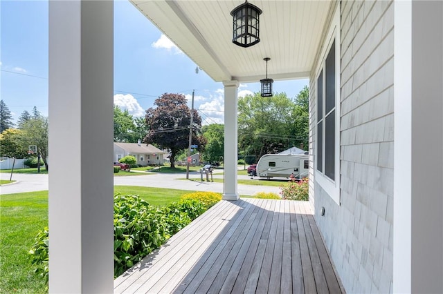 96 Evergreen St, Cumberland, RI 02864 - wooden porch featuring a yard