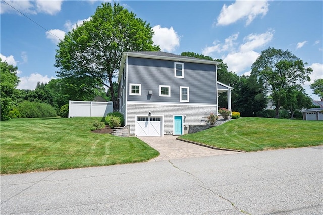 96 Evergreen St, Cumberland, RI 02864 - view of home's exterior with decorative driveway and an attached garage