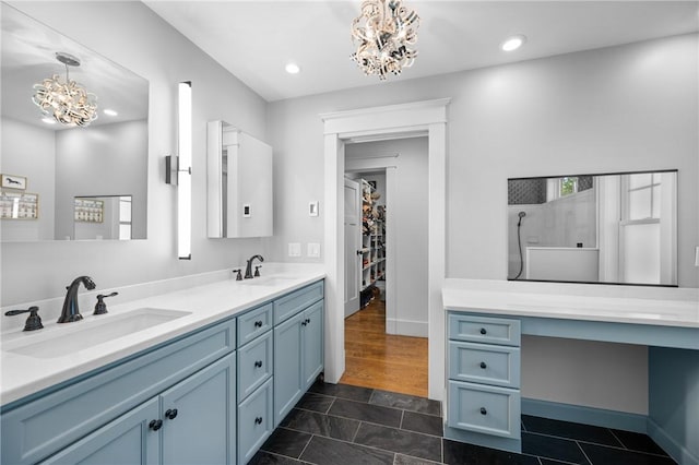 96 Evergreen St, Cumberland, RI 02864 - full bath featuring a chandelier, double vanity, a walk in shower, recessed lighting, and a walk in closet