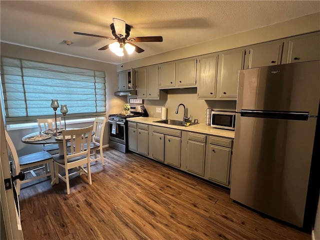 494 Putnam Pike Unit A12, Smithfield, RI 02828 - kitchen featuring appliances with stainless steel finishes, gray cabinets, light countertops, and dark wood-style floors
