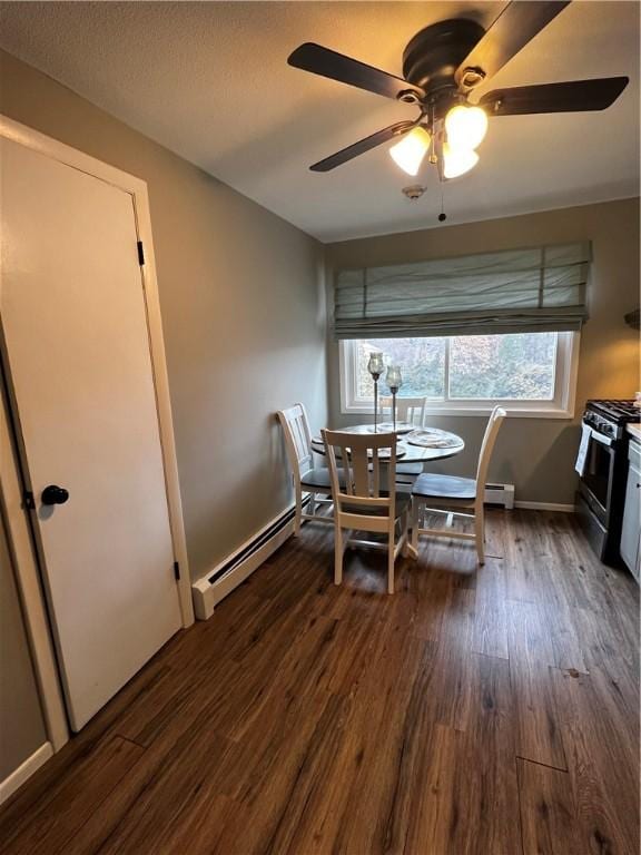 494 Putnam Pike Unit A12, Smithfield, RI 02828 - dining room featuring a baseboard radiator, dark wood-style floors, and a ceiling fan
