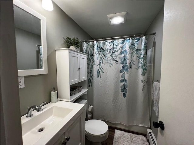 494 Putnam Pike Unit A12, Smithfield, RI 02828 - bathroom featuring a baseboard radiator, vanity, shower / bathtub combination with curtain, and wood finished floors