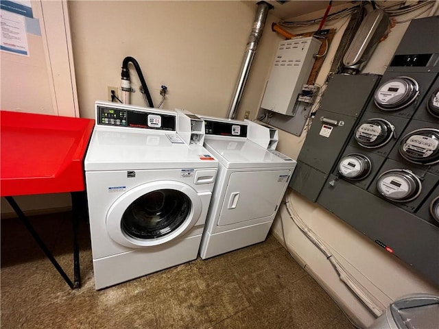 494 Putnam Pike Unit A12, Smithfield, RI 02828 - laundry room with washing machine and dryer and tile patterned floors