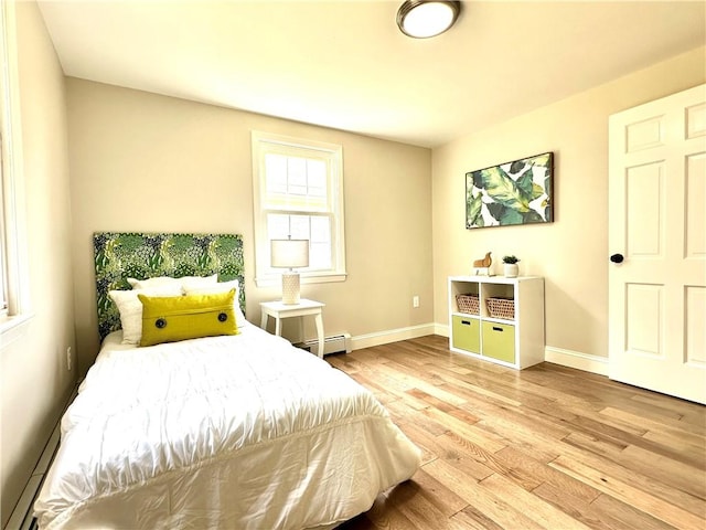 16 Goulart Ave, Bristol, RI 02809 - bedroom with a baseboard radiator and wood finished floors