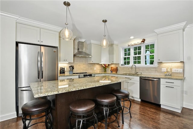 107 Pottersville Rd, Little Compton, RI 02837 - kitchen featuring appliances with stainless steel finishes, wall chimney range hood, white cabinets, dark wood finished floors, and a center island