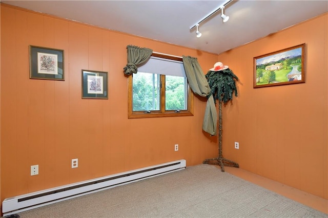 107 Pottersville Rd, Little Compton, RI 02837 - unfurnished room with a baseboard heating unit, track lighting, and carpet floors