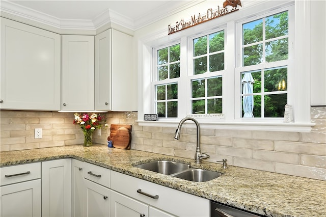107 Pottersville Rd, Little Compton, RI 02837 - kitchen with white cabinetry, tasteful backsplash, light stone countertops, and ornamental molding