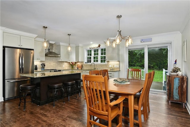 107 Pottersville Rd, Little Compton, RI 02837 - dining room featuring a chandelier, crown molding, and dark wood finished floors