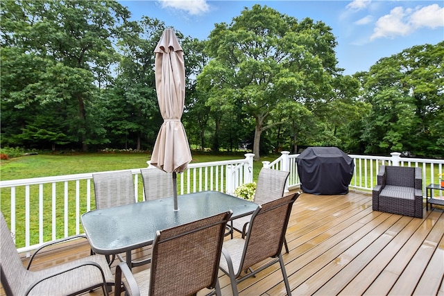 107 Pottersville Rd, Little Compton, RI 02837 - deck with grilling area, outdoor dining space, a yard, and view of scattered trees