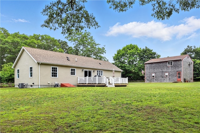 107 Pottersville Rd, Little Compton, RI 02837 - rear view of property with a wooden deck and a lawn