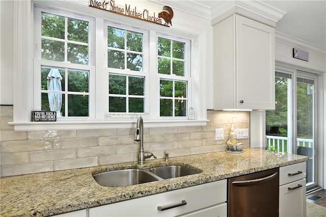 107 Pottersville Rd, Little Compton, RI 02837 - kitchen with stainless steel dishwasher, white cabinets, crown molding, backsplash, and light stone counters