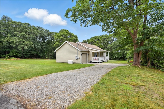 107 Pottersville Rd, Little Compton, RI 02837 - view of front of home with driveway, a front yard, an attached garage, and covered porch