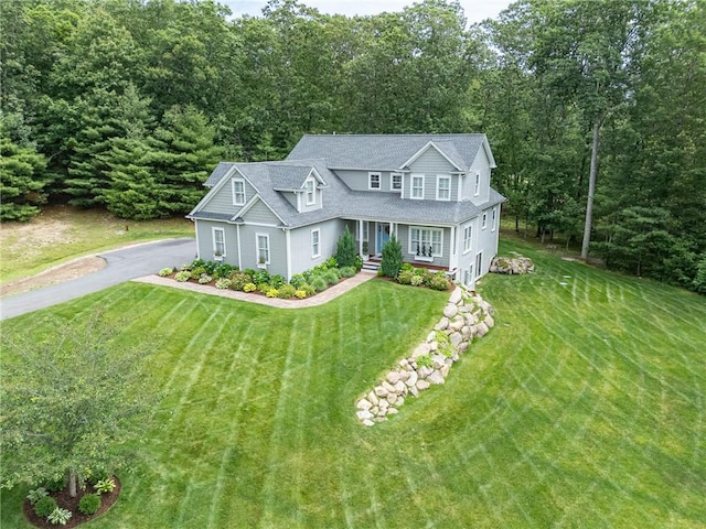 64 Knight View Dr, West Greenwich, RI 02817 - view of front facade with driveway, a porch, and a front lawn