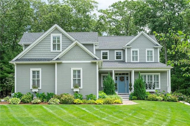 64 Knight View Dr, West Greenwich, RI 02817 - view of front of property featuring a front lawn and roof with shingles