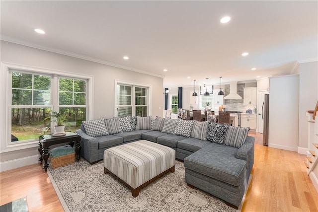 64 Knight View Dr, West Greenwich, RI 02817 - living room featuring ornamental molding, recessed lighting, light wood finished floors, and stairs