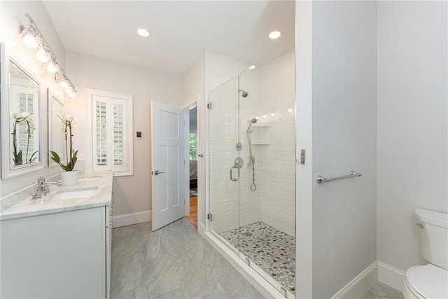 64 Knight View Dr, West Greenwich, RI 02817 - ensuite bathroom with double vanity, a shower stall, marble finish floors, and recessed lighting