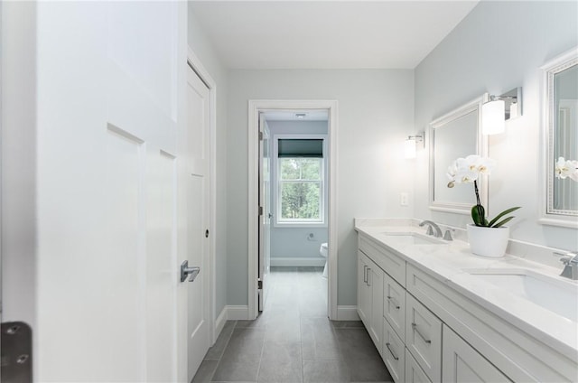 64 Knight View Dr, West Greenwich, RI 02817 - bathroom featuring double vanity and tile patterned flooring