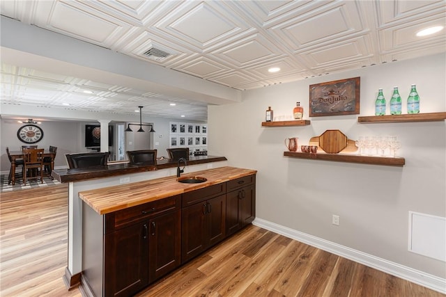 64 Knight View Dr, West Greenwich, RI 02817 - bar with light wood finished floors, an ornate ceiling, recessed lighting, and decorative columns