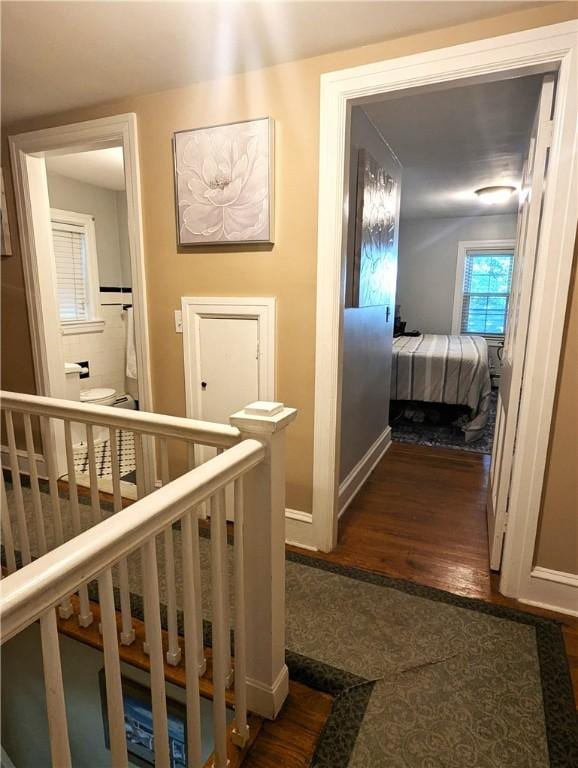 125 Roger Williams, East Providence, RI 02916 - hall with dark wood-type flooring and an upstairs landing