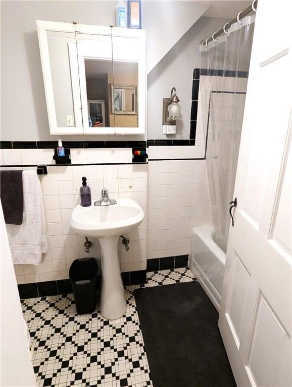 125 Roger Williams, East Providence, RI 02916 - full bathroom with tile walls, shower / bath combo with shower curtain, a wainscoted wall, and tile patterned floors