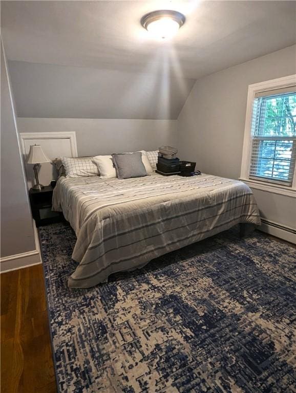 125 Roger Williams, East Providence, RI 02916 - bedroom with dark wood-style floors, vaulted ceiling, and baseboard heating