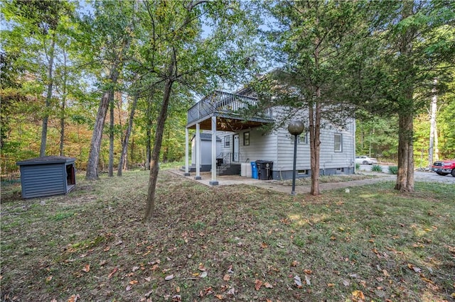 12 Leddy Rd, Cumberland, RI 02864 - back of house with a wooden deck and an outdoor structure