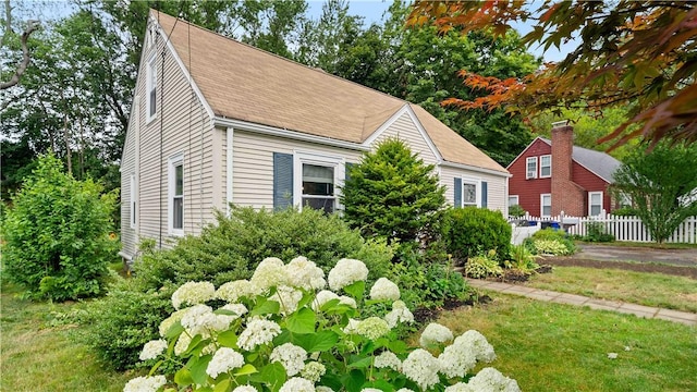 74 Algonquin Rd, East Providence, RI 02916 - view of side of property featuring a shingled roof