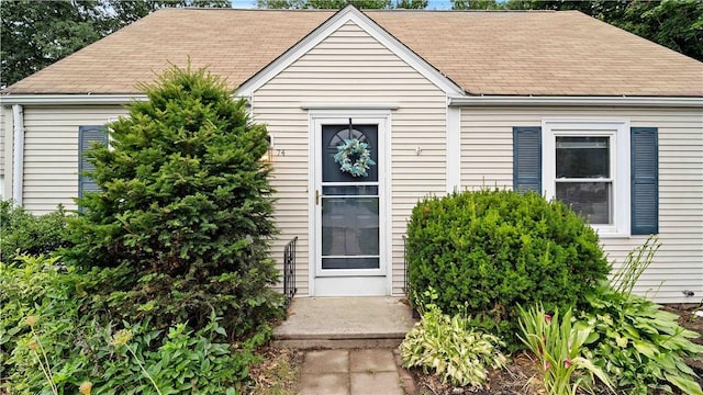 74 Algonquin Rd, East Providence, RI 02916 - view of front facade with a shingled roof