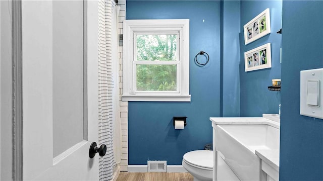 74 Algonquin Rd, East Providence, RI 02916 - full bath featuring wood finished floors, vanity, and curtained shower