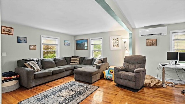 74 Algonquin Rd, East Providence, RI 02916 - living room featuring a wall unit AC and light wood-type flooring