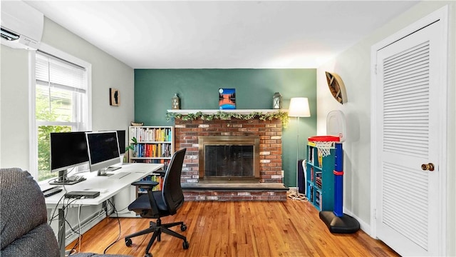 74 Algonquin Rd, East Providence, RI 02916 - office with wood finished floors, a fireplace, and a wall unit AC